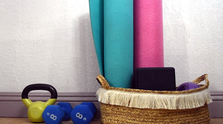 organized yoga and workout gear in basket